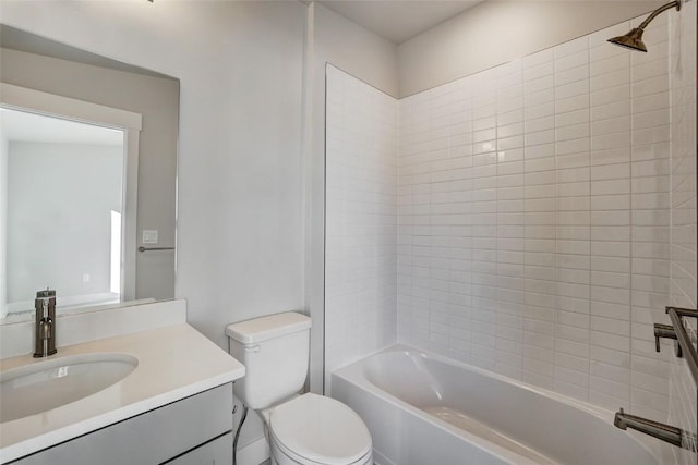 bathroom featuring shower / bathtub combination, toilet, and vanity
