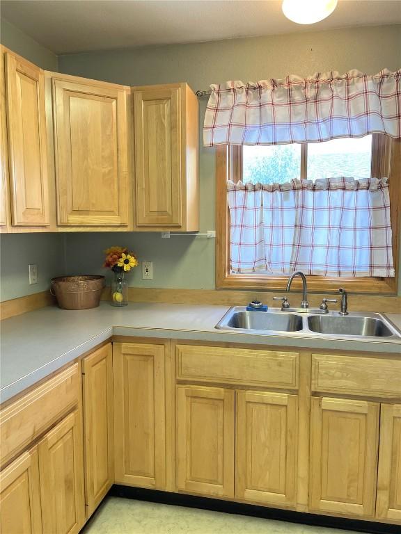 21725 4th Ave, Phippsburg, CO 80469 - kitchen with light brown cabinets and light countertops