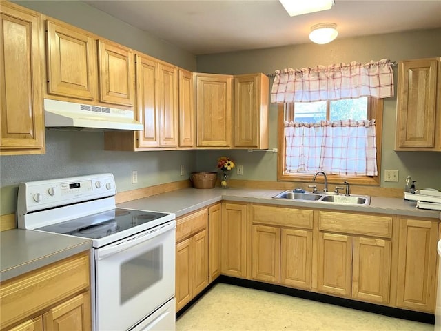 21725 4th Ave, Phippsburg, CO 80469 - kitchen with white electric range, under cabinet range hood, and light brown cabinets