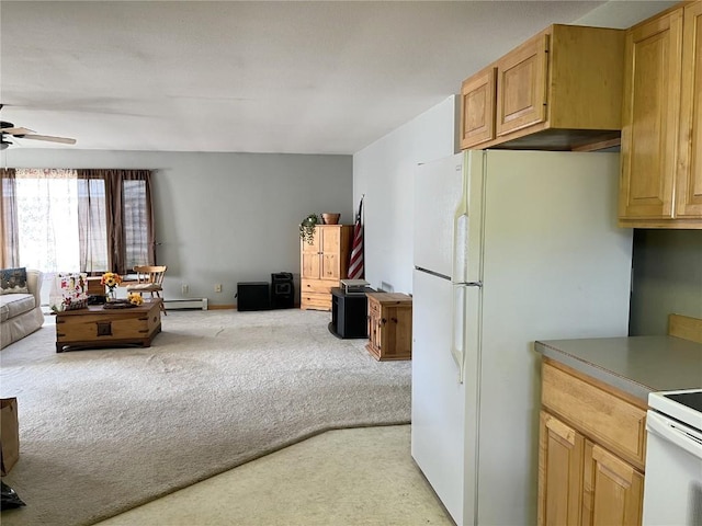 21725 4th Ave, Phippsburg, CO 80469 - kitchen with open floor plan, light carpet, ceiling fan, freestanding refrigerator, and range