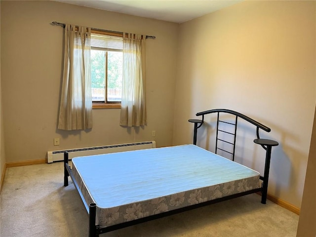 21725 4th Ave, Phippsburg, CO 80469 - bedroom featuring a baseboard heating unit and light carpet