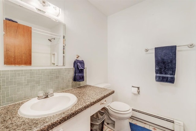 bathroom featuring sink, decorative backsplash, toilet, walk in shower, and a baseboard radiator