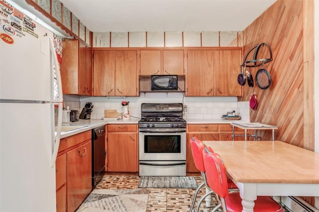 kitchen featuring backsplash and black appliances