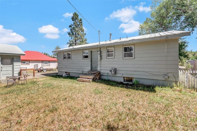 back of house with a yard