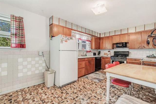 kitchen with black appliances and sink