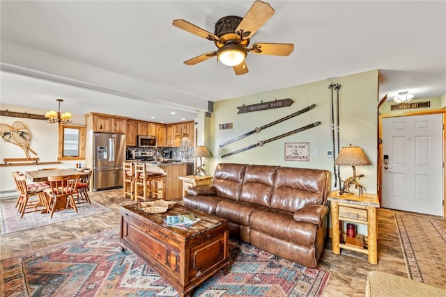 living room with a baseboard radiator, recessed lighting, and ceiling fan with notable chandelier