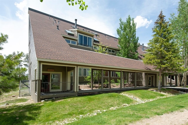 21640 US Highway 6 Unit 2122, Keystone, CO 80435 - back of house with roof with shingles and a lawn
