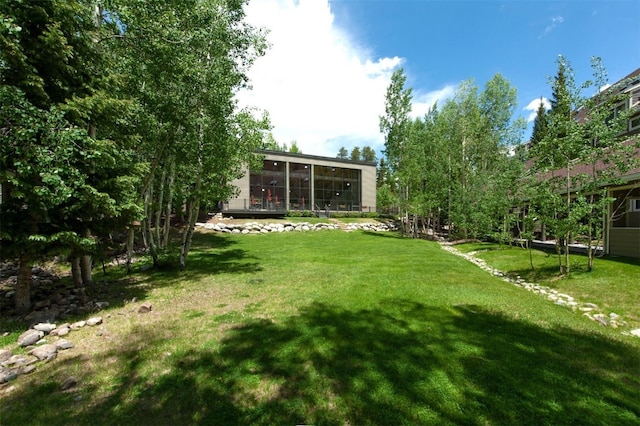 21640 US Highway 6 Unit 2122, Keystone, CO 80435 - view of green lawn featuring a sunroom
