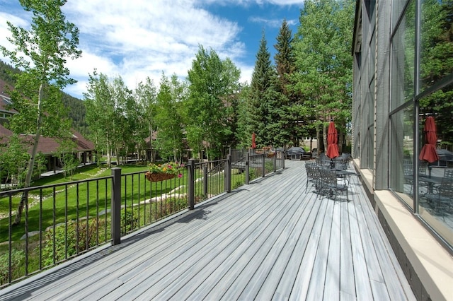 21640 US Highway 6 Unit 2122, Keystone, CO 80435 - deck featuring a lawn and view of wooded area