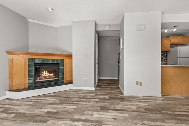 20 Sequoia Ct Unit 20, Steamboat Springs, CO 80487 - unfurnished living room featuring wood finished floors, a fireplace, baseboards, and recessed lighting