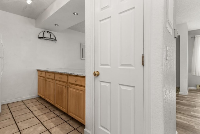 20 Sequoia Ct Unit 20, Steamboat Springs, CO 80487 - bar area featuring a textured ceiling and baseboards
