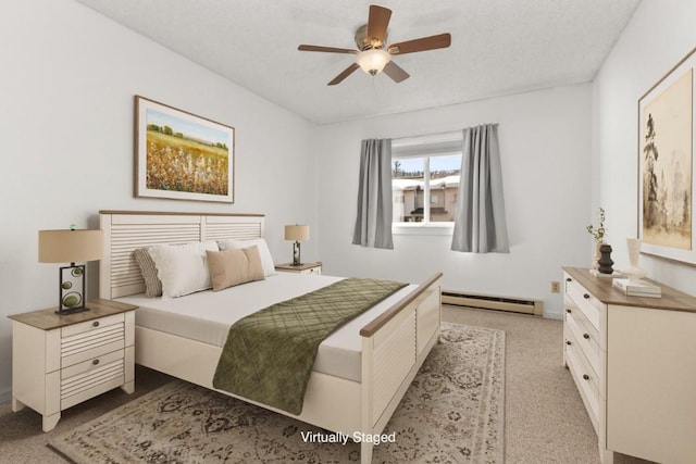 20 Sequoia Ct Unit 20, Steamboat Springs, CO 80487 - bedroom with a baseboard radiator, light carpet, and a ceiling fan