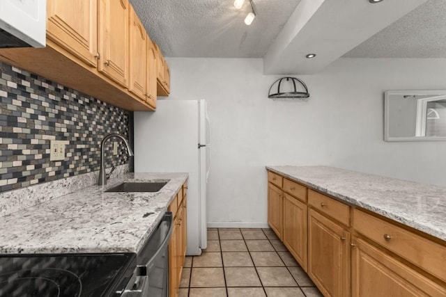 20 Sequoia Ct Unit 20, Steamboat Springs, CO 80487 - kitchen featuring a sink, a textured ceiling, backsplash, black range with electric stovetop, and dishwasher