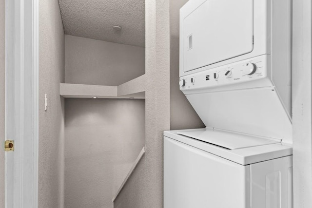 20 Sequoia Ct Unit 20, Steamboat Springs, CO 80487 - washroom with stacked washer and clothes dryer and a textured ceiling