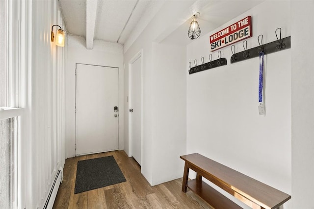 mudroom with baseboard heating and wood finished floors