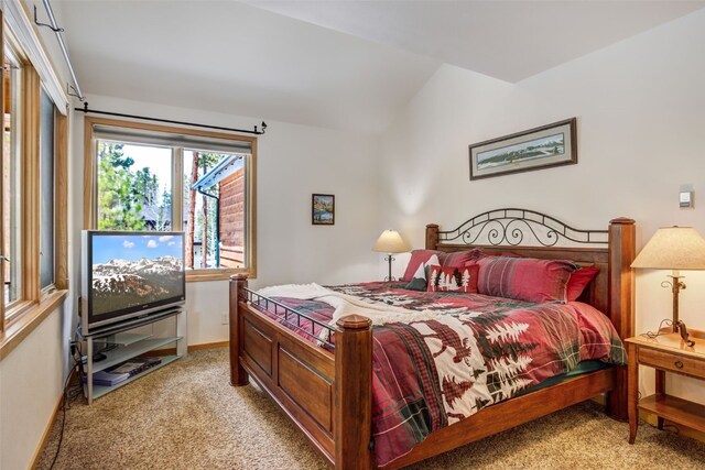 bedroom featuring baseboards and light carpet