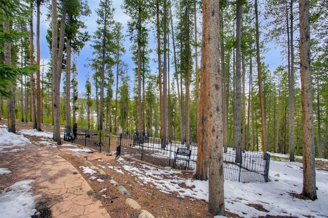view of home's community featuring fence and a gate