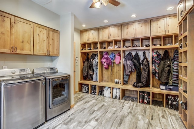 clothes washing area with a ceiling fan, cabinet space, wood finished floors, separate washer and dryer, and recessed lighting