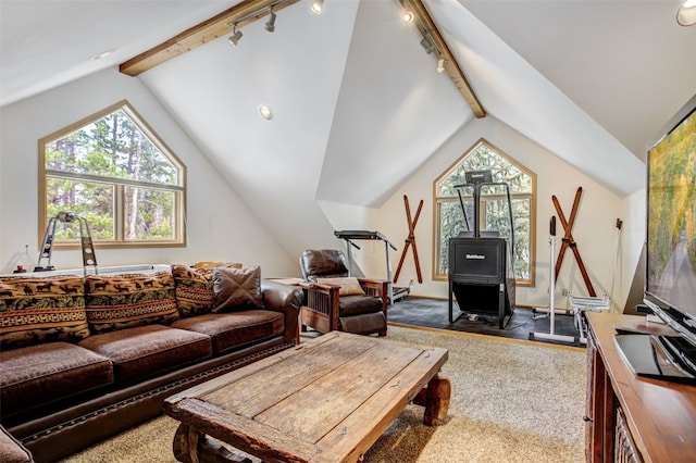 living room featuring lofted ceiling with beams, carpet flooring, and rail lighting