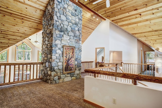 additional living space with carpet floors, wooden ceiling, and plenty of natural light