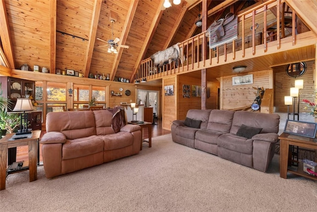 26635 Neptune Pl, Clark, CO 80428 - living room with carpet, wooden ceiling, wooden walls, high vaulted ceiling, and beamed ceiling