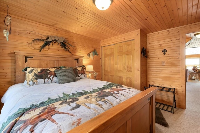 26635 Neptune Pl, Clark, CO 80428 - bedroom featuring light colored carpet, wood walls, a closet, and wooden ceiling