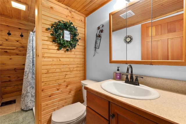 26635 Neptune Pl, Clark, CO 80428 - bathroom featuring wooden ceiling, toilet, vanity, wood walls, and a shower with curtain
