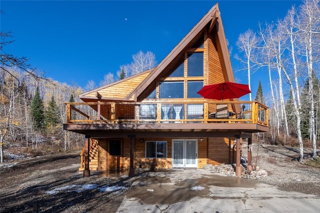26635 Neptune Pl, Clark, CO 80428 - back of property with a wooden deck and a patio area