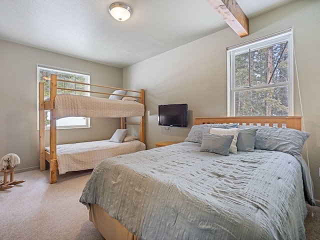 234 Peterson Dr, Alma, CO 80440 - carpeted bedroom featuring multiple windows and beamed ceiling