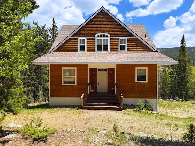 234 Peterson Dr, Alma, CO 80440 - bungalow featuring a shingled roof and a wooded view