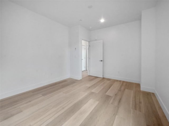 740 Blue River Pkwy Unit A21, Silverthorne, CO 80498 - spare room with baseboards, recessed lighting, and light wood-style floors