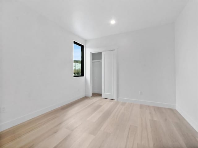 740 Blue River Pkwy Unit A21, Silverthorne, CO 80498 - unfurnished bedroom with light wood-type flooring, baseboards, and a closet