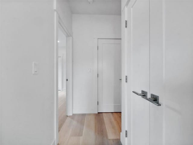 740 Blue River Pkwy Unit A21, Silverthorne, CO 80498 - hall featuring wood finished floors and baseboards