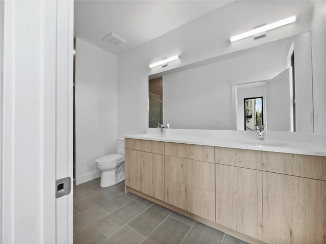 740 Blue River Pkwy Unit A21, Silverthorne, CO 80498 - full bath featuring a sink, double vanity, toilet, tile patterned flooring, and a shower stall