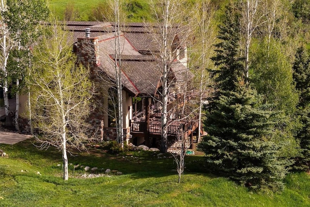 31695 Aspen Ridge Rd, Steamboat Springs, CO 80487 - back of property featuring a lawn and a chimney