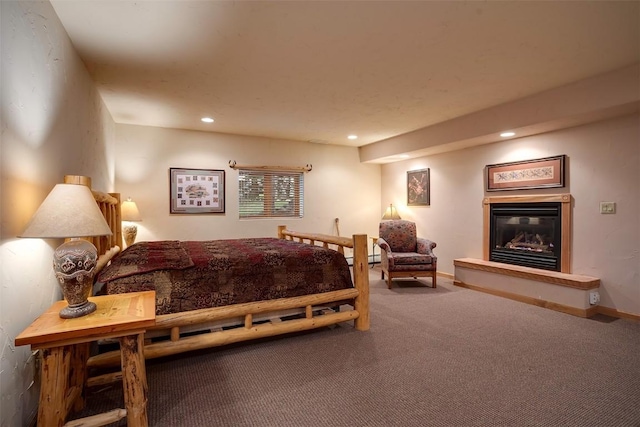 31695 Aspen Ridge Rd, Steamboat Springs, CO 80487 - bedroom featuring carpet, a glass covered fireplace, and recessed lighting
