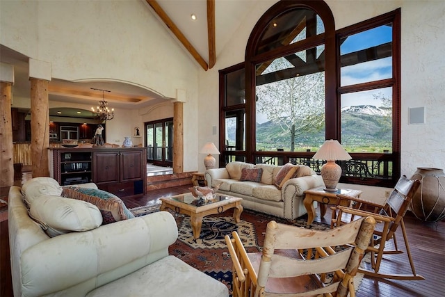 31695 Aspen Ridge Rd, Steamboat Springs, CO 80487 - living room featuring dark wood-style floors, high vaulted ceiling, beam ceiling, and a chandelier