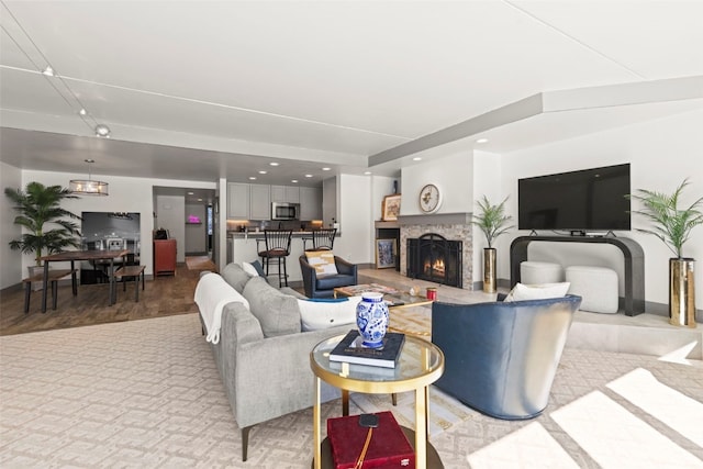 living room with a lit fireplace