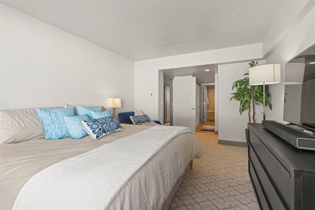 bedroom featuring light colored carpet