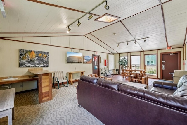 4200 Lodge Pole Cir Unit 205, Silverthorne, CO 80498 - carpeted living area with track lighting, lofted ceiling, wood walls, and wood ceiling