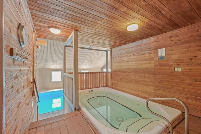 4200 Lodge Pole Cir Unit 205, Silverthorne, CO 80498 - misc room with a jacuzzi, wood walls, wood ceiling, and plenty of natural light