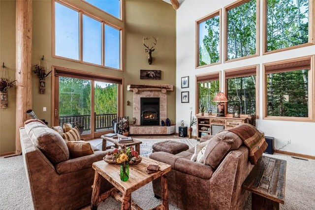 1996 Al Gulch Rd, Jefferson, CO 80456 - carpeted living area with a high ceiling and a tiled fireplace