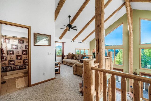 1996 Al Gulch Rd, Jefferson, CO 80456 - carpeted living room featuring high vaulted ceiling, a ceiling fan, and beam ceiling