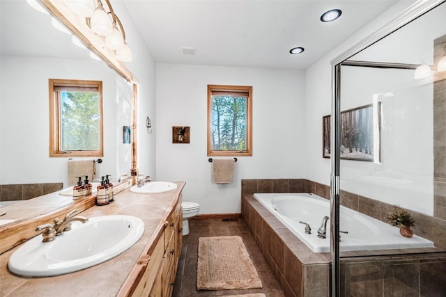 1996 Al Gulch Rd, Jefferson, CO 80456 - full bath featuring plenty of natural light, a garden tub, double vanity, and recessed lighting