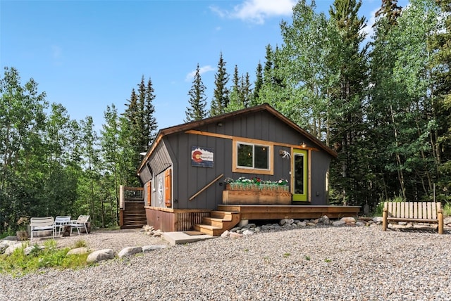 932 Peterson Dr, Alma, CO 80420 - rustic home featuring a deck, stairs, and board and batten siding