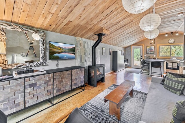 932 Peterson Dr, Alma, CO 80420 - living room featuring wood finished floors, vaulted ceiling, a wood stove, and wood ceiling