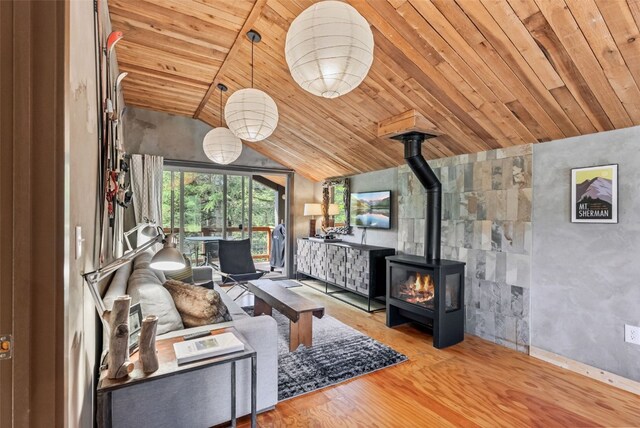 932 Peterson Dr, Alma, CO 80420 - living room with wood ceiling, lofted ceiling, wood finished floors, and a wood stove