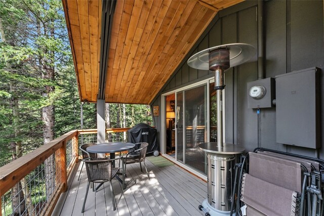 932 Peterson Dr, Alma, CO 80420 - wooden deck with outdoor dining space and a grill