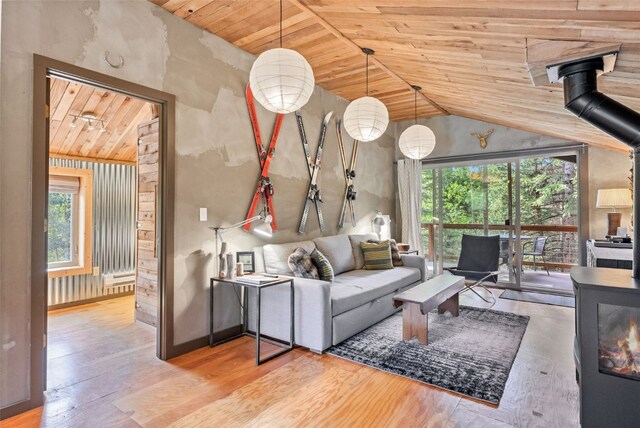 932 Peterson Dr, Alma, CO 80420 - living room featuring wooden ceiling, a wood stove, vaulted ceiling, and wood finished floors