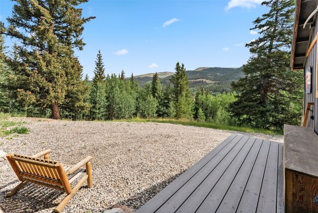 932 Peterson Dr, Alma, CO 80420 - wooden deck with a mountain view and a wooded view